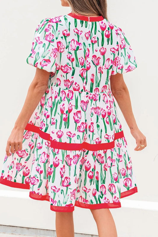 Dress with pink tulip pattern on a white background